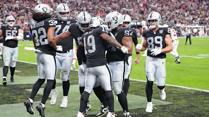 Sep 29, 2024; Paradise, Nevada, USA; Las Vegas Raiders wide receiver DJ Turner (19) celebrates with team mates after scoring a touchdown against the Cleveland Browns during the third quarter at Allegiant Stadium. Mandatory Credit: Stephen R. Sylvanie-Imagn Images Sep 29, 2024; Paradise, Nevada, USA; Las Vegas Raiders wide receiver DJ Turner (19) celebrates with team mates after scoring a touchdown against the Cleveland Browns during the third quarter at Allegiant Stadium. Mandatory Credit: Stephen R. Sylvanie-Imagn Images