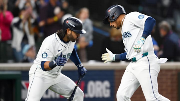 Oct 5, 2025; Seattle, Washington, USA; Seattle Mariners second baseman Jorge Polanco (7) celebrates his solo home run with third baseman Eugenio Suarez (28) in the sixth inning against the Detroit Tigers during game two of the ALDS round for the 2025 MLB playoffs at T-Mobile Park. Mandatory Credit: Steven Bisig-Imagn Images
