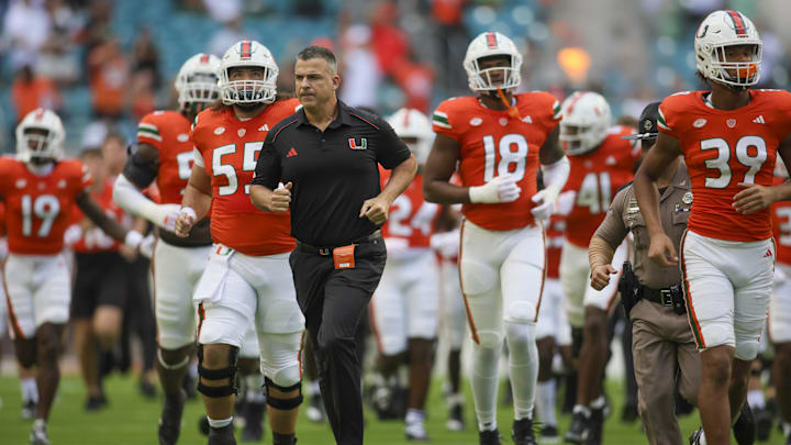 Oct 28, 2023; Miami Gardens, Florida, USA; Miami Hurricanes head coach Mario Cristobal takes on the