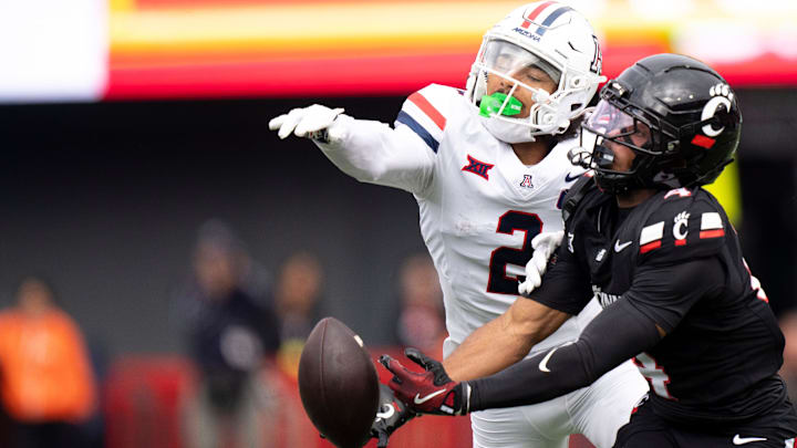 Cincinnati Bearcats wide receiver Cyrus Allen (4) drops a pass as Arizona Wildcats defensive back Treydan Stukes (2) defends in the first quarter of the NCAA football game between the Cincinnati Bearcats and Arizona Wildcats at Nippert Stadium in Cincinnati on Nov. 15, 2025.