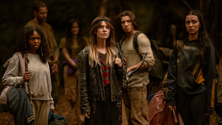 L-R: Silvana Estifanos as Teen Britt, Joel McHale as Kodiak, Ashley Sutton as Hanna, Sophie Thatcher as Teen Natalie, Kevin Alves as Teen Travis and Anisa Harris as Teen Robin in Yellowjackets, episode 8, season 3