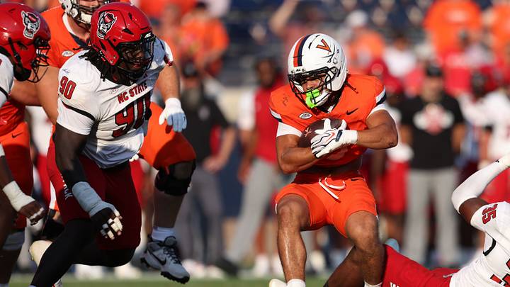 Aug 29, 2026; Charlottesville, Virginia, USA; Virginia Cavaliers running back Noah Vaughn (3) rushes the ball during the game against the North Carolina State Wolfpack at Scott Stadium. Mandatory Credit: Greg Atkins-Imagn Images Aug 29, 2026; Charlottesville, Virginia, USA; Virginia Cavaliers running back Noah Vaughn (3) rushes the ball during the game against the North Carolina State Wolfpack at Scott Stadium. Mandatory Credit: Greg Atkins-Imagn Images