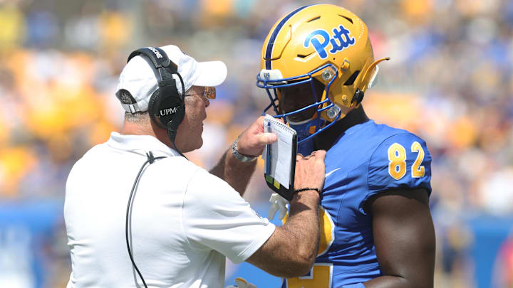 Aug 30, 2025; Pittsburgh, Pennsylvania, USA; Pittsburgh Panthers head coach Pat Narduzzi (left) talks with tight end Malachi Thomas (82) after a personal foul by Thomas against the Duquesne Dukes during the third quarter at Acrisure Stadium. Mandatory Credit: Charles LeClaire-Imagn Images