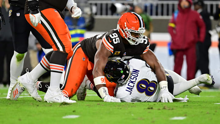 Nov 16, 2025; Cleveland, Ohio, USA; Cleveland Browns defensive end Myles Garrett (95) reacts after sacking Baltimore Ravens quarterback Lamar Jackson (8) during the second quarter at Huntington Bank Field. Mandatory Credit: Ken Blaze-Imagn Images