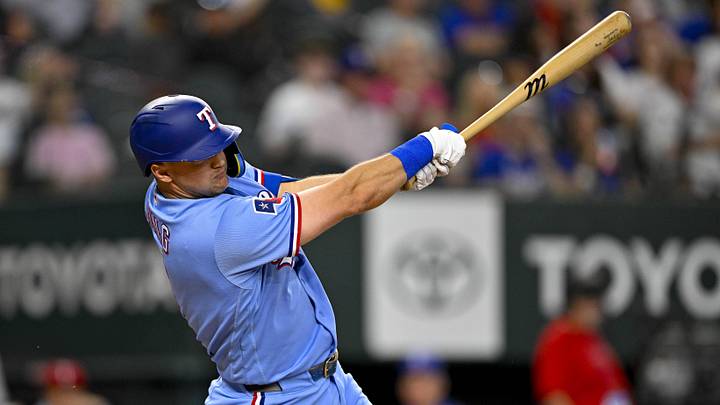 Texas Rangers third baseman Josh Jung hits a single.