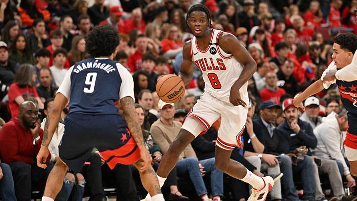 Oct 24, 2026; Chicago, Illinois, USA;  Chicago Bulls forward Caleb Wilson (8) controls the ball against Washington Wizards forward Justin Champagnie (9) during the first half at United Center.  Mandatory Credit: Patrick Gorski-Imagn Images