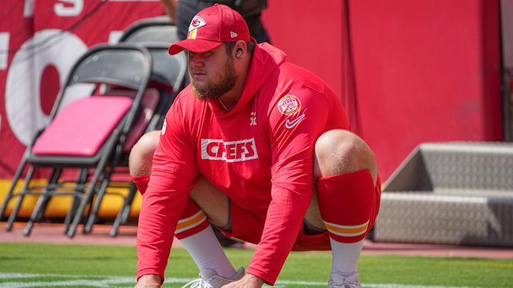 Sep 15, 2024; Kansas City, Missouri, USA; Kansas City Chiefs center Creed Humphrey (52) stretches out against the Cincinnati Bengals prior to a game at GEHA Field at Arrowhead Stadium. Mandatory Credit: Denny Medley-Imagn Images