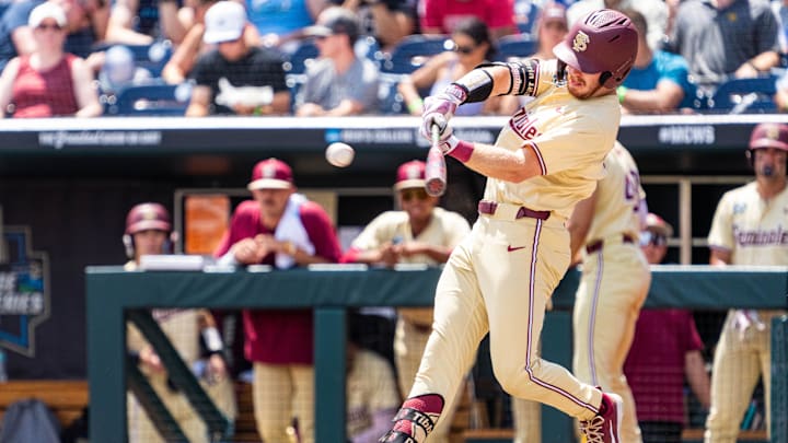 Jun 18, 2024; Omaha, NE, USA; Florida State Seminoles right fielder James Tibbs III (22) hits a double against the North Carolina Tar Heels during the fifth inning at Charles Schwab Field Omaha. 