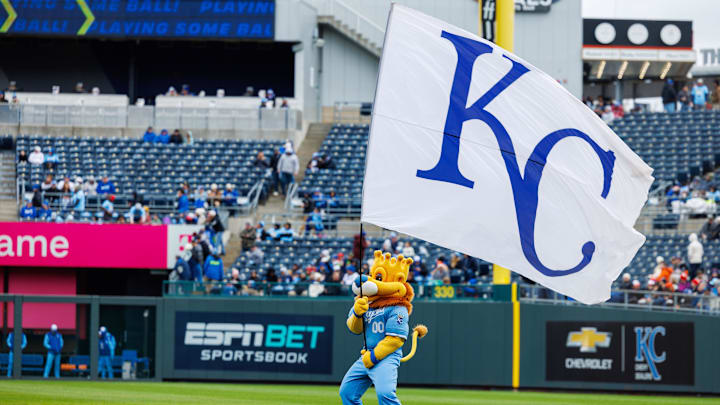 Apr 5, 2025; Kansas City, Missouri, USA; Kansas City Royals mascot Sluggerrr waves the flag prior to the game against the Baltimore Orioles at Kauffman Stadium. Mandatory Credit: William Purnell-Imagn Images Apr 5, 2025; Kansas City, Missouri, USA; Kansas City Royals mascot Sluggerrr waves the flag prior to the game against the Baltimore Orioles at Kauffman Stadium. Mandatory Credit: William Purnell-Imagn Images