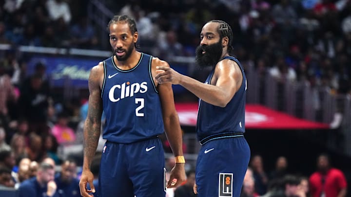 Nov 24, 2023; Los Angeles, California, USA; LA Clippers forward Kawhi Leonard (2) and guard James Harden (1) talk during their game against the New Orleans Pelicans in the second half at Crypto.com Arena. 