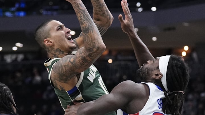 Dec 3, 2025; Milwaukee, Wisconsin, USA; Milwaukee Bucks forward Kyle Kuzma (18) drives to the basket against Detroit Pistons forward Isaiah Stewart (28) in the first half at Fiserv Forum. Mandatory Credit: Michael McLoone-Imagn Images