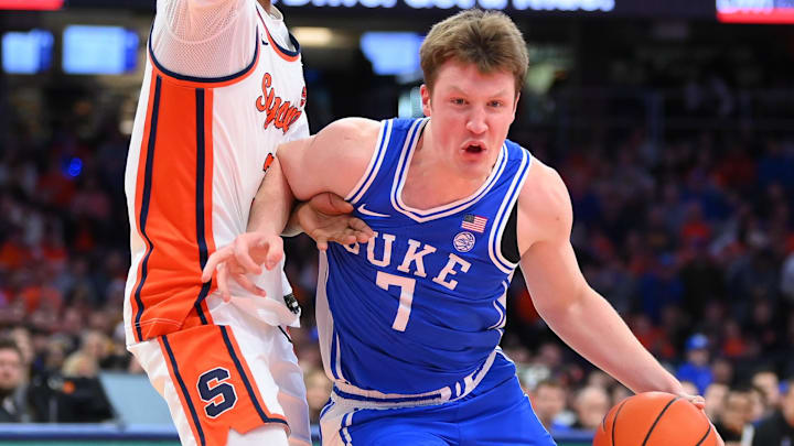 Feb 5, 2025; Syracuse, New York, USA; Duke Blue Devils guard Kon Knueppel (7) drives against Syracuse Orange guard Lucas Taylor (3) during the first half at the JMA Wireless Dome. Feb 5, 2025; Syracuse, New York, USA; Duke Blue Devils guard Kon Knueppel (7) drives against Syracuse Orange guard Lucas Taylor (3) during the first half at the JMA Wireless Dome.