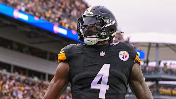 Oct 12, 2025; Pittsburgh, Pennsylvania, USA; Pittsburgh Steelers wide receiver DK Metcalf (4) celebrates a touchdown against the Cleveland Browns during the fourth quarter at Acrisure Stadium. Mandatory Credit: Barry Reeger-Imagn Images