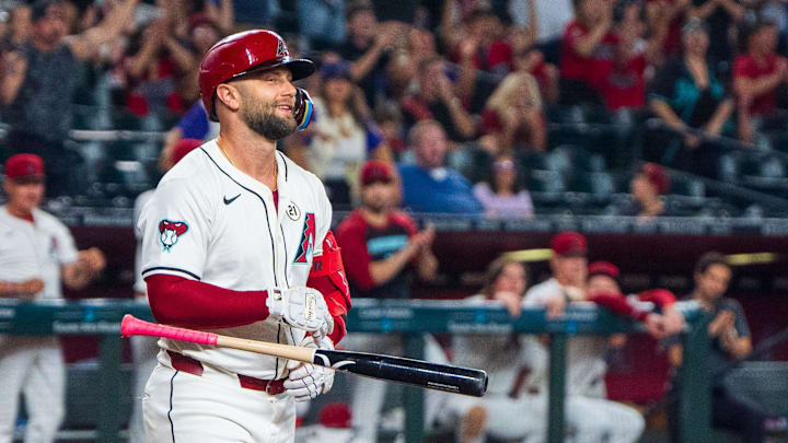 Sep 15, 2024; Phoenix, Arizona, USA; Arizona Diamondbacks infielder Christian Walker (53) reacts after getting hit by a pitch to load the bases in the tenth inning during a game against the Milwaukee Brewers at Chase Field. The Diamondbacks beat the Brewers 11-10. Sep 15, 2024; Phoenix, Arizona, USA; Arizona Diamondbacks infielder Christian Walker (53) reacts after getting hit by a pitch to load the bases in the tenth inning during a game against the Milwaukee Brewers at Chase Field. The Diamondbacks beat the Brewers 11-10.