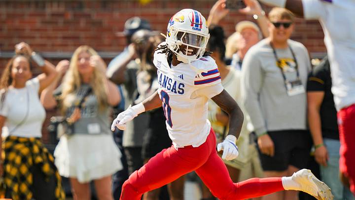 Sep 6, 2025; Columbia, Missouri, USA; Kansas Jayhawks defensive back Austin Alexander (0) celebrates after recovering a fumble for a touchdown during the first half against the Missouri Tigers at Faurot Field at Memorial Stadium. Mandatory Credit: Jay Biggerstaff-Imagn Images Sep 6, 2025; Columbia, Missouri, USA; Kansas Jayhawks defensive back Austin Alexander (0) celebrates after recovering a fumble for a touchdown during the first half against the Missouri Tigers at Faurot Field at Memorial Stadium. Mandatory Credit: Jay Biggerstaff-Imagn Images