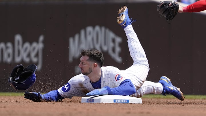 Jun 1, 2025; Chicago, Illinois, USA; Cincinnati Reds second base Matt McLain (9) tags out Chicago Cubs outfielder Kyle Tucker (30) on a steal attempt of second base during the first inning at Wrigley Field. Jun 1, 2025; Chicago, Illinois, USA; Cincinnati Reds second base Matt McLain (9) tags out Chicago Cubs outfielder Kyle Tucker (30) on a steal attempt of second base during the first inning at Wrigley Field.