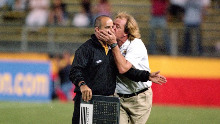 Former Miami Fusion manager Ray Hudson kisses an official during a 2000 match against the Chicago Fire at Lockhart Stadium.