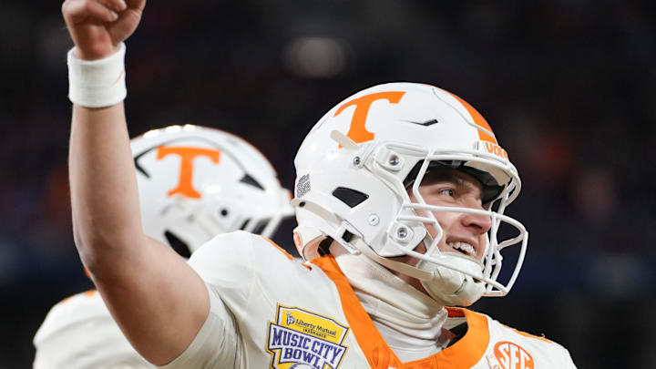 Tennessee quarterback Joey Aguilar (6) celebrates after scoring a touchdown in the Music City Bowl against Illinois in an NCAA college football game on Dec. 30, 2025, in Nashville, Tennessee.