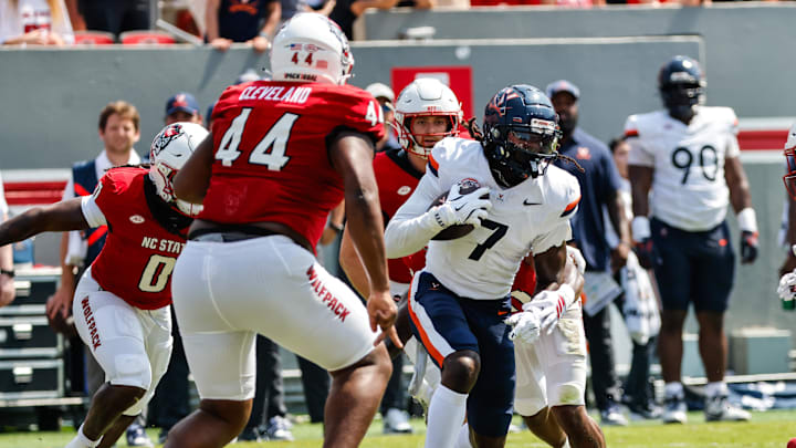 Sep 6, 2025; Raleigh, North Carolina, USA;Virginia Cavaliers wide receiver Jahmal Edrine (7) runs with the football during the first half of the game against North Carolina State Wolfpack at Carter-Finley Stadium. Mandatory Credit: Jaylynn Nash-Imagn Images Sep 6, 2025; Raleigh, North Carolina, USA;Virginia Cavaliers wide receiver Jahmal Edrine (7) runs with the football during the first half of the game against North Carolina State Wolfpack at Carter-Finley Stadium. Mandatory Credit: Jaylynn Nash-Imagn Images