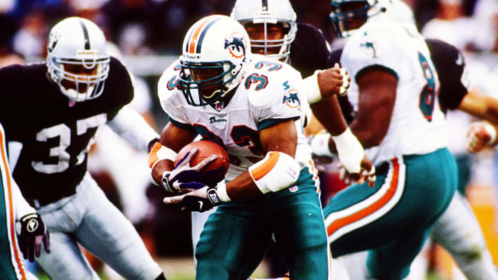Miami Dolphins running back Karim Abdul-Jabbar (33) in action against the Oakland Raiders at Oakland-Alameda County Coliseum in 1997. Miami Dolphins running back Karim Abdul-Jabbar (33) in action against the Oakland Raiders at Oakland-Alameda County Coliseum in 1997.