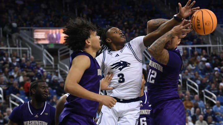 Nevada's Tyler Rollison knocks the ball away from the UW's Luis Kortright in Saturday's game in Reno.  