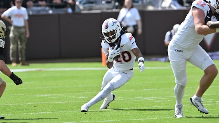 Sep 20, 2025; Blacksburg, Va.; Virginia Tech running back P.J. Prioleau (20) runs the ball during the first quarter.