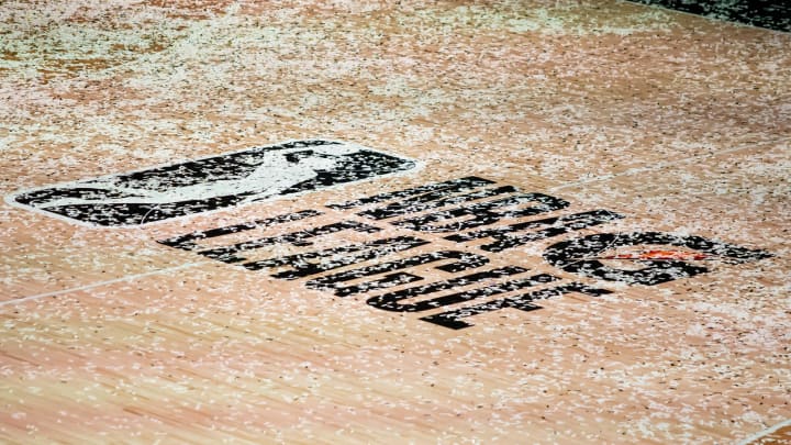 Mar 11, 2021; Orlando, Florida, USA; The NBA G League logo is covered in confetti after the Final between the Delaware Blue Coats and the Lakeland Magic at AdventHealth Arena. 