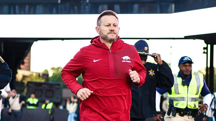 Arkansas Razorbacks coach Ryan Silverfield runs to midfield to shake hands with Vanderbilt coach Clark Lea after a 31-21 victory. Arkansas Razorbacks coach Ryan Silverfield runs to midfield to shake hands with Vanderbilt coach Clark Lea after a 31-21 victory.