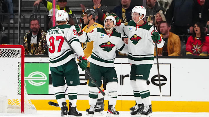 Feb 12, 2024; Las Vegas, Nevada, USA; Minnesota Wild right wing Mats Zuccarello (36) celebrates with Minnesota Wild left wing Kirill Kaprizov (97) and Minnesota Wild center Joel Eriksson Ek (14) after scoring a goal against the Vegas Golden Knights during the first period at T-Mobile Arena. Mandatory Credit: Stephen R. Sylvanie-Imagn Images