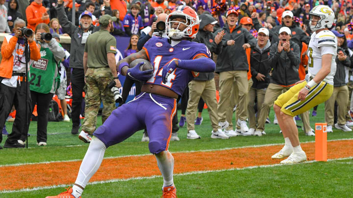 Nov 11, 2023; Clemson, South Carolina, USA; Clemson Tigers cornerback Shelton Lewis (14) returns an interception for a touchdown against the Georgia Tech Yellow Jackets during the fourth quarter at Memorial Stadium. Mandatory Credit: Ken Ruinard-USA TODAY Sports