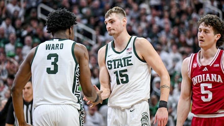 Michigan State's Carson Cooper, right, celebrates with Cam Ward, left, after Ward's score an Indiana foul during the second half on Tuesday, Jan. 13, 2026, at the Breslin Center in East Lansing.