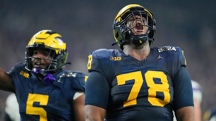 Michigan defensive lineman Kenneth Grant celebrates a sack on Washington quarterback Michael Penix Jr. in the second quarter during the College Football Playoff national championship game against Washington at NRG Stadium in Houston, Texas on Monday, Jan. 8, 2024. Michigan defensive lineman Kenneth Grant celebrates a sack on Washington quarterback Michael Penix Jr. in the second quarter during the College Football Playoff national championship game against Washington at NRG Stadium in Houston, Texas on Monday, Jan. 8, 2024.