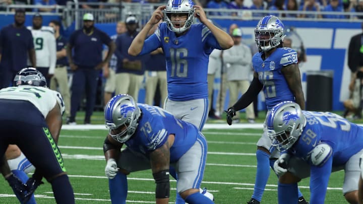 Detroit Lions quarterback Jared Goff runs the offense as guard Jonah Jackson (73) and tackle Penei Sewell (58) listen in against the Seattle Seahawks during the first half at Ford Field, Sunday, Sept. 17, 2023.