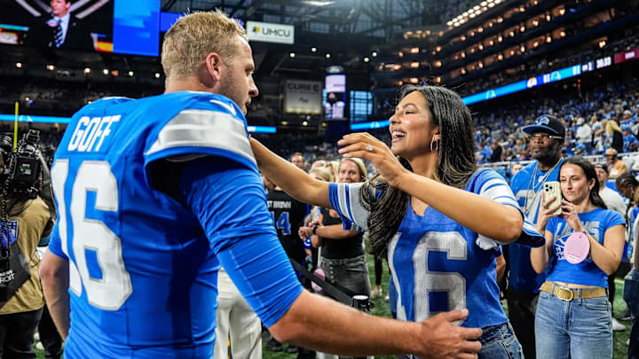 Detroit Lions quarterback Jared Goff hugs his wife Christen Harper during warmups before the season opener against the Los Angeles Rams at Ford Field in Detroit on Sunday, Sept. 8, 2024. Detroit Lions quarterback Jared Goff hugs his wife Christen Harper during warmups before the season opener against the Los Angeles Rams at Ford Field in Detroit on Sunday, Sept. 8, 2024.