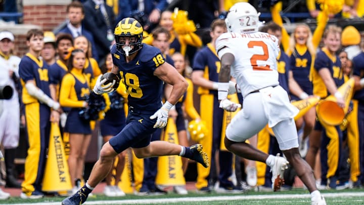 Michigan tight end Colston Loveland (18) makes a catch against Texas defensive back Derek Williams Jr. (2) during the first half at Michigan Stadium in Ann Arbor on Saturday, September 7, 2024. Michigan tight end Colston Loveland (18) makes a catch against Texas defensive back Derek Williams Jr. (2) during the first half at Michigan Stadium in Ann Arbor on Saturday, September 7, 2024.
