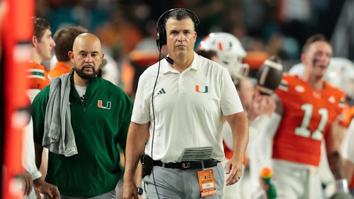 Sep 6, 2025; Miami Gardens, Florida, USA; Miami Hurricanes head coach Mario Cristobal looks on from the sideline against the Bethune-Cookman Wildcats during the second quarter at Hard Rock Stadium. Mandatory Credit: Sam Navarro-Imagn Images