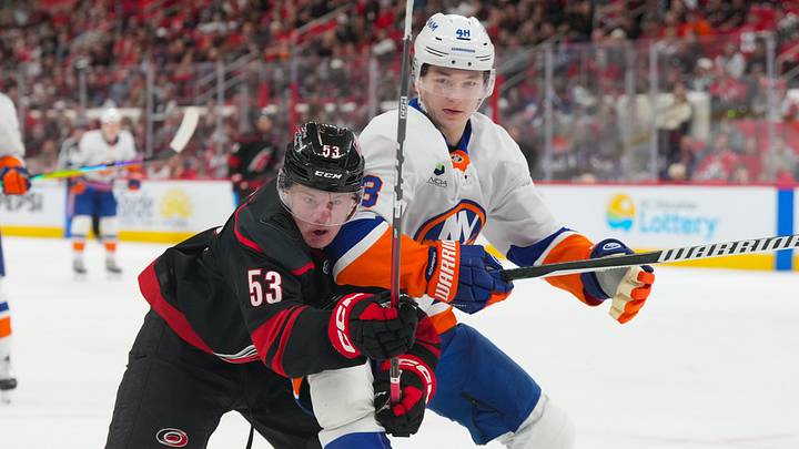 Apr 4, 2026; Raleigh, North Carolina, USA;  Carolina Hurricanes right wing Jackson Blake (53) and New York Islanders defenseman Matthew Schaefer (48) chase after the puck during the third period at Lenovo Center. Mandatory Credit: James Guillory-Imagn Images