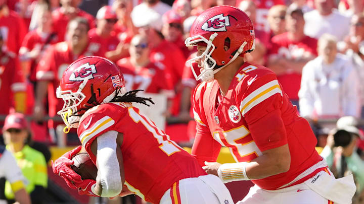Oct 19, 2025; Kansas City, Missouri, USA; Kansas City Chiefs quarterback Patrick Mahomes (15) hands the ball to running back Isiah Pacheco (10) against the Las Vegas Raiders during the first quarter of the game at GEHA Field at Arrowhead Stadium. Mandatory Credit: Denny Medley-Imagn Images