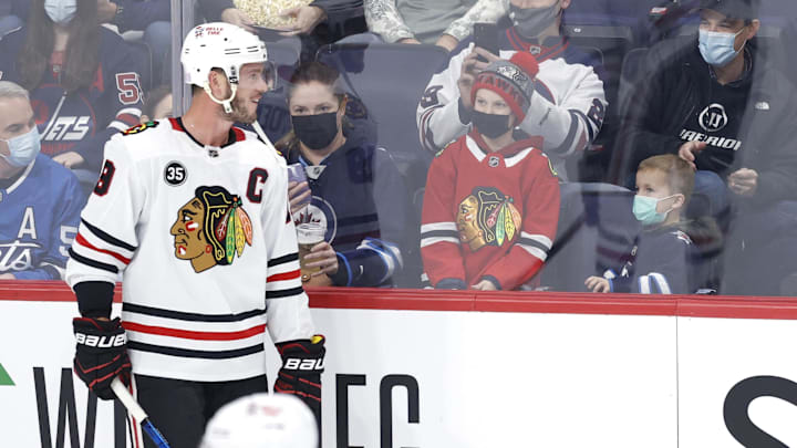 Chicago Blackhawks center Jonathan Toews spends a moment with fans prior to a game against the Winnipeg Jets.