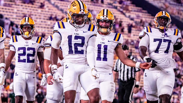 Sep 20, 2025; Baton Rouge, Louisiana, USA;  LSU Tigers wide receiver Kyle Parker (12) reacts to scoring a touchdown against the Southeastern Louisiana Lions during the second half at Tiger Stadium. Mandatory Credit: Stephen Lew-Imagn Images