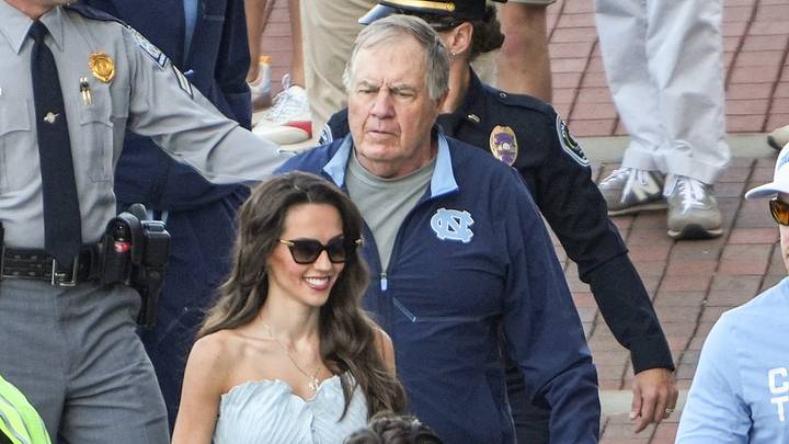 University of North Carolina Head Coach Bill Belichick and Jordon Hudson get off the bus as Clemson does their Tiger Walk before the game at Memorial Stadium in Clemson, S.C. Saturday, September 19, 2026. University of North Carolina Head Coach Bill Belichick and Jordon Hudson get off the bus as Clemson does their Tiger Walk before the game at Memorial Stadium in Clemson, S.C. Saturday, September 19, 2026.