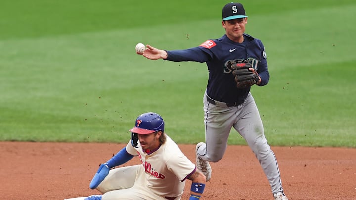 Aug 20, 2025; Philadelphia, Pennsylvania, USA; Seattle Mariners second base Cole Young (2) throws for a double play after tagging out Philadelphia Phillies second base Bryson Stott (5) during the fourth inning at Citizens Bank Park. Mandatory Credit: Bill Streicher-Imagn Images