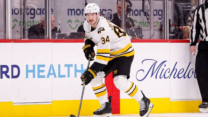 Mar 21, 2026; Detroit, Michigan, USA; Boston Bruins left wing Tanner Jeannot (84) handles the puck during the third period against the Detroit Red Wings at Little Caesars Arena. Mandatory Credit: Brian Bradshaw Sevald-Imagn Images