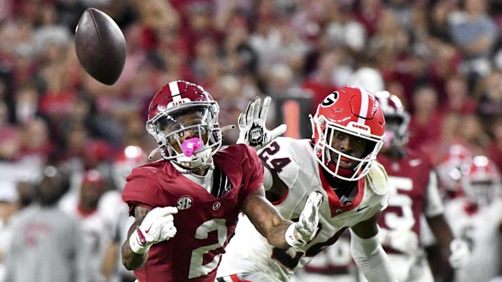 Sep 28, 2024; Tuscaloosa, Alabama, USA;  Alabama Crimson Tide wide receiver Ryan Williams (2) makes a catch against Georgia Bulldogs defensive back Malaki Starks (24) at Bryant-Denny Stadium. Alabama defeated Georgia 41-34. Mandatory Credit: Gary Cosby Jr.-Imagn Images