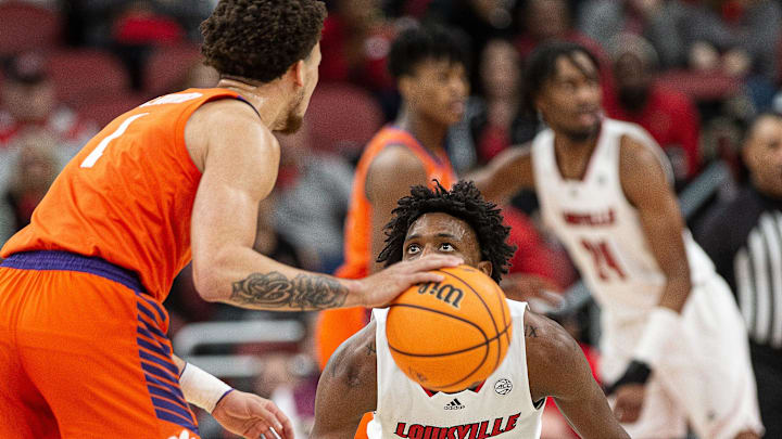 Louisville guard Hercy Miller (15) kept his eyes open on defense as the Louisville Cardinals hosted