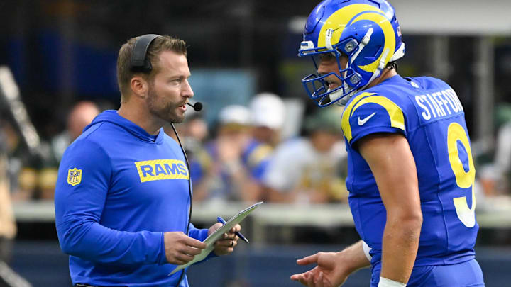 Oct 6, 2024; Inglewood, California, USA; Los Angeles Rams head coach Sean McVay talks to quarterback Matthew Stafford (9). Mandatory Credit: Robert Hanashiro-Imagn Images