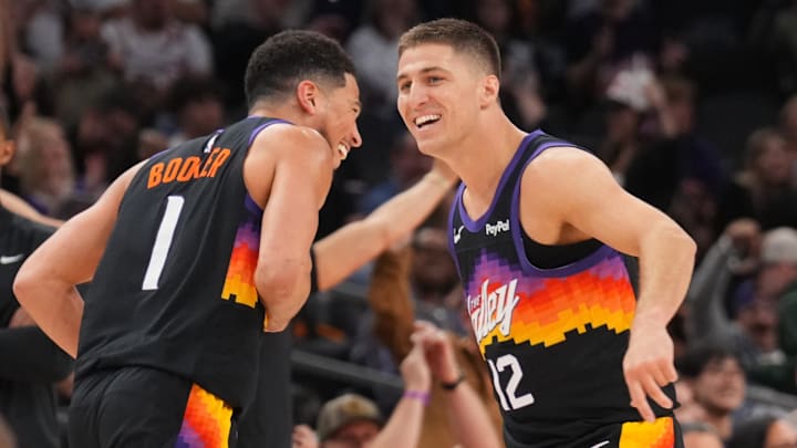 Mar 8, 2026; Phoenix, Arizona, USA; Phoenix Suns guard Devin Booker (1) and Phoenix Suns guard Collin Gillespie (12) react against the Charlotte Hornets during the second half at Mortgage Matchup Center. Mandatory Credit: Joe Camporeale-Imagn Images
