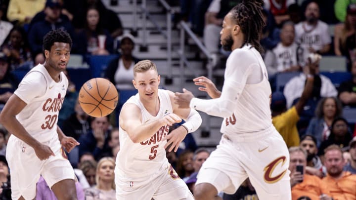 Mar 13, 2024; New Orleans, Louisiana, USA; Cleveland Cavaliers guard Sam Merrill (5) passes the ball to guard Darius Garland (10) against the New Orleans Pelicans during the first half at Smoothie King Center. Mandatory Credit: Stephen Lew-USA TODAY Sports