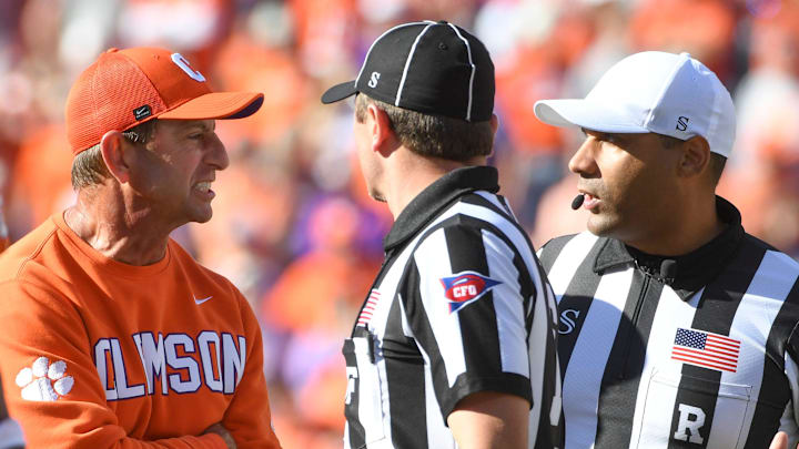 Clemson Tigers head coach Dabo Swinney talks to officials