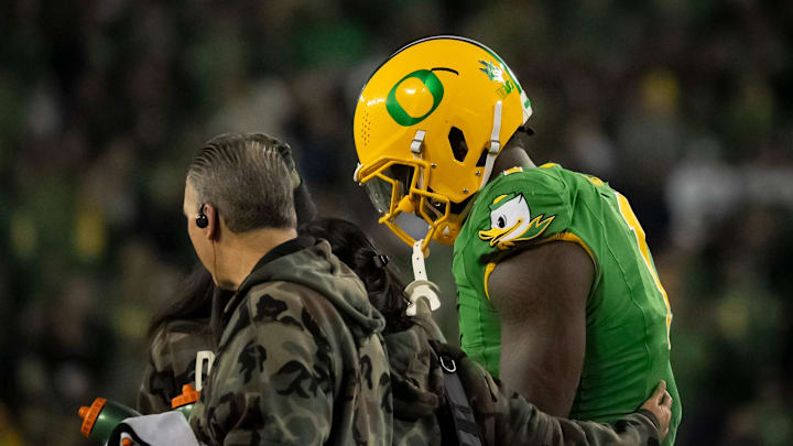 Oregon defensive end Jordan Burch is helped off the field as the Oregon Ducks host the Maryland Terrapins at Autzen Stadium Saturday, Nov. 9, 2024 in Eugene, Ore.
